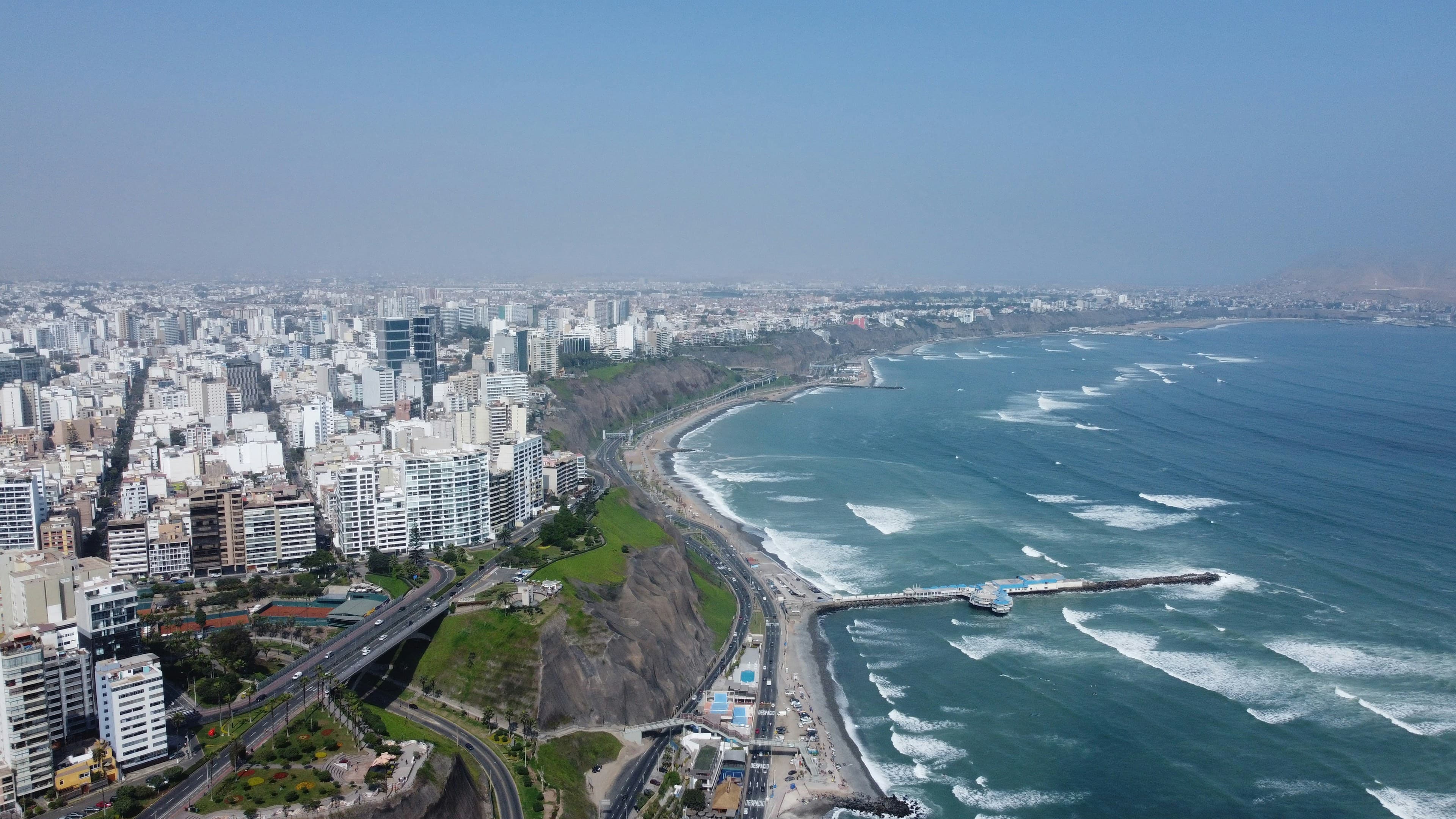 The Miraflores district of Lima on the cliffs above the Pacific, the Costa Verde coastline curving along the ocean.
